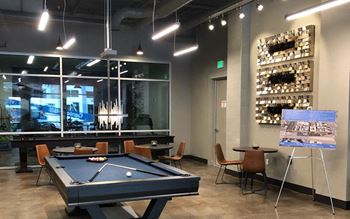 The game room: game lounge complete with professional billiards, shuffleboard and flat screen tv.